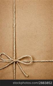 Package in brown paper tied with string