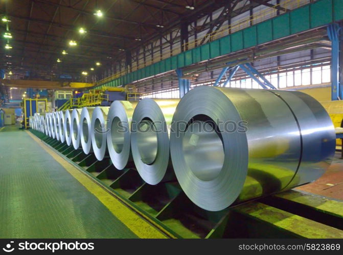 packed coils of steel sheet inside of plant