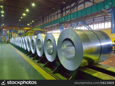 packed coils of steel sheet inside of plant