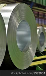 packed rolls of steel sheet in a warehouse
