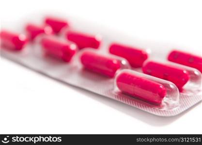 packs of medical capsules on white background