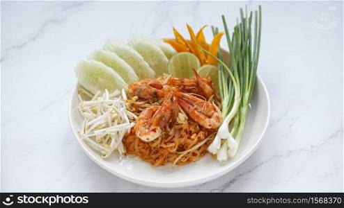 Pad Thai, Pud Thai stir fried noodle with shrimp served with mung bean sprout, cucumber, lime, chilli and spring onion