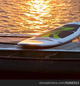 Paddleboard on the dock by the lake, Lake of The Woods, Ontario, Canada