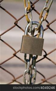 Padlock and wire mesh fence