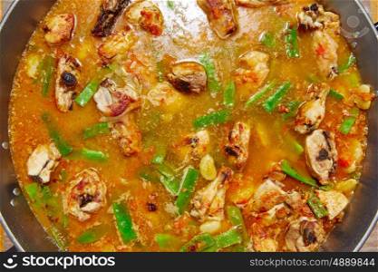 Paella from Spain recipe process ad water to get the broth boil