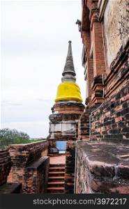 Pagoda and Buddha Status at Wat Yai Chaimongkol famous and popular tourist destinations Ayutthaya, Thailand.