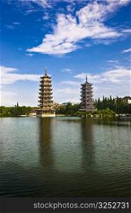 Pagodas at lakeside, Sun And Moon Pagoda, Banyan Lake, Guilin, Guangxi Province, China