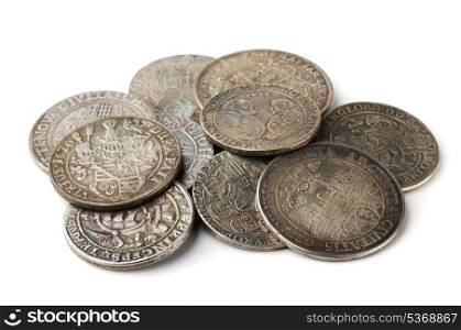 Pail of thalers - ancient european silver coins isolated on white