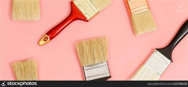 Paint brush on pink background, how to choose the perfect home paint color and good for health
