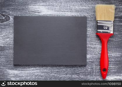 paint brush on wooden painted background texture