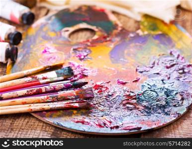 paint brushes on a palette