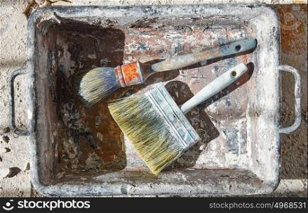 Paint brushes used on debris improvement background