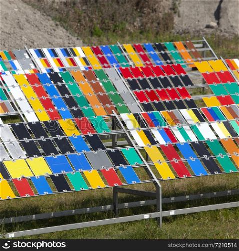paint colors are tested by exposing them to the fierce summer sunlight on norderney in northern germany