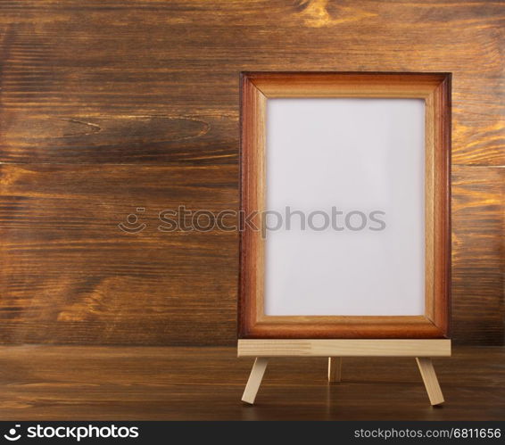 paint frame on wooden background