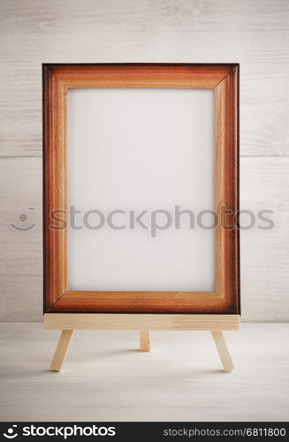 paint frame on wooden background