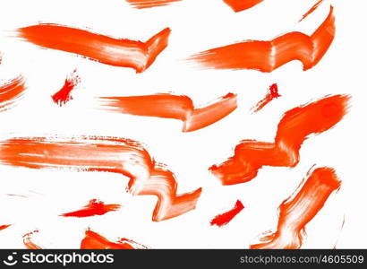 Paint smears. Abstract smears of orange paint on white background