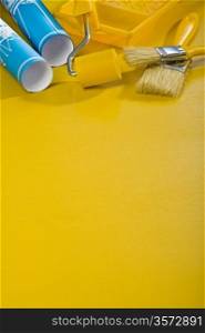 paint tools on yellow background with copyspace