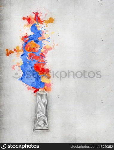 Paint tube. Image of paint tube with color splashes