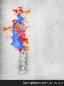 Paint tube. Image of paint tube with color splashes