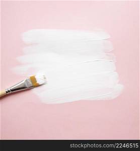 paintbrush applying color paper