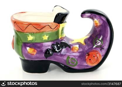 Painted ceramic witch&acute;s boot.