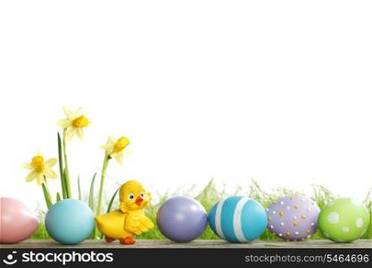 Painted easter eggs, chick and flowers over white background