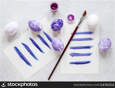 painted eggs with pastel violet colors easter