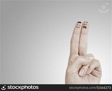 Painted finger smiley isolated on white