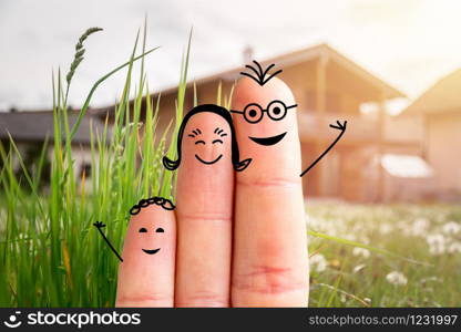 Painted fingers happy family concept moving into a new home