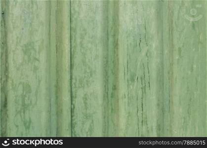 Painted grunge green tin wall suface as background