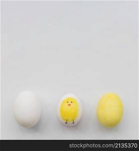 painted three eggs white background