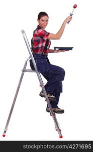 Painter climbing ladder