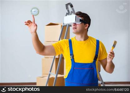 Painter contractor working with virtual reality goggles