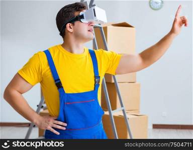 Painter contractor working with virtual reality goggles. The painter contractor working with virtual reality goggles