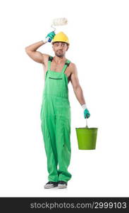 Painter in green coveralls on white