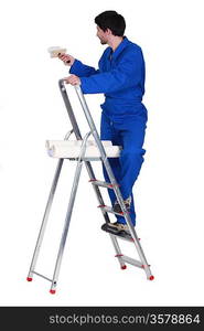 painter in jumpsuit on ladder isolated on white