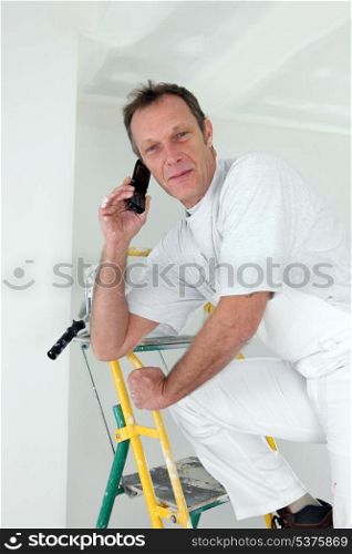 Painter taking a call