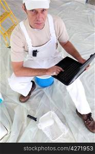 Painter using his laptop