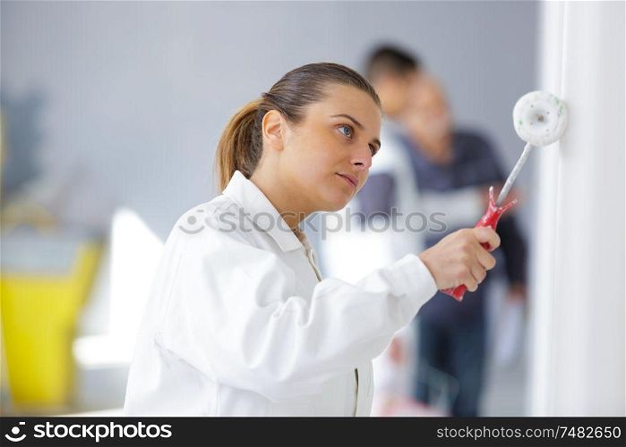 painter woman with painting roller