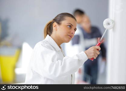 painter woman with painting roller