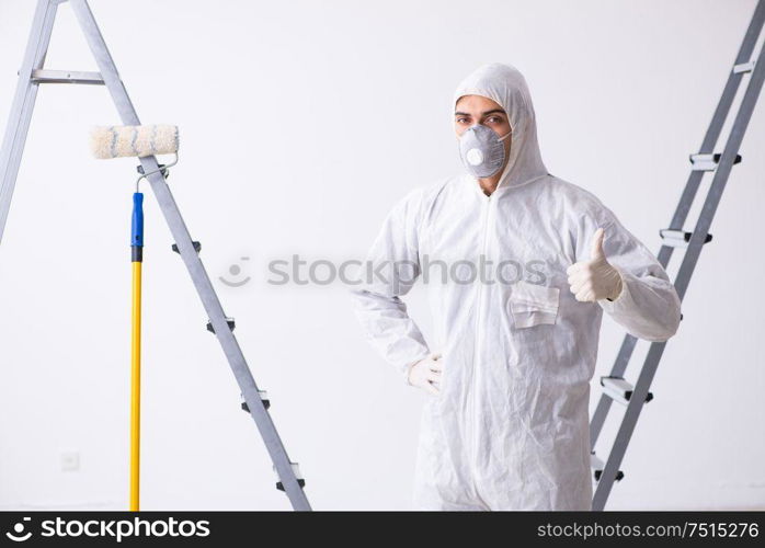 Painter working at the construction site. Painter working at construction site