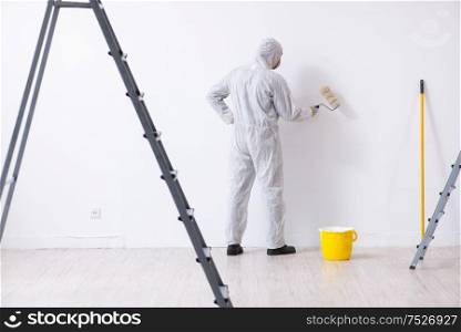 Painter working at the construction site. Painter working at construction site