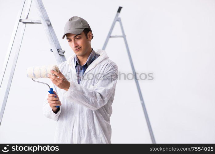 Painter working at the construction site. Painter working at construction site