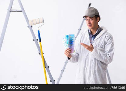 Painter working at the construction site. Painter working at construction site