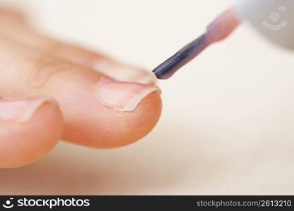painting a nail with nail varnish