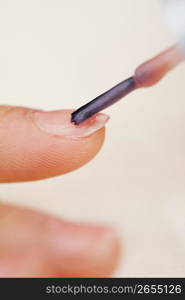 painting a nail with nail varnish