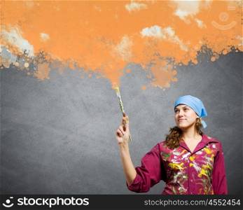 Painting and creativity. Young girl painter with brush wearing bandana