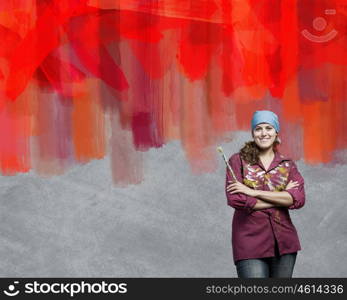 Painting and creativity. Young girl painter with brush wearing bandana