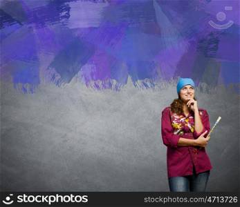 Painting and creativity. Young girl painter with brush wearing bandana