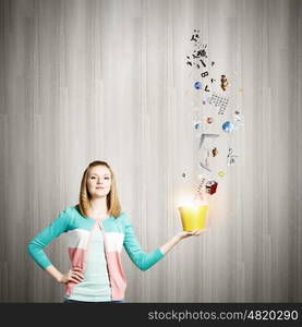 Painting concept. Young girl holding bucket with colorful splashes